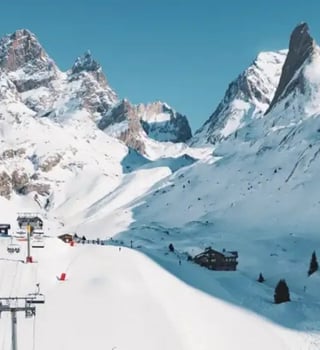 Sunny pistes and chairlift beneath the jagged peaks of Pralognan-la-Vanoise