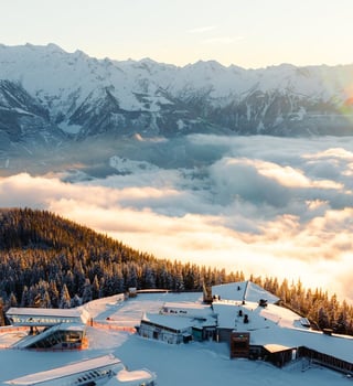 Sunrise over a sea of cloud from the Schmittenhöhe summit above Zell am See, with the Hohe Tauern peaks behind