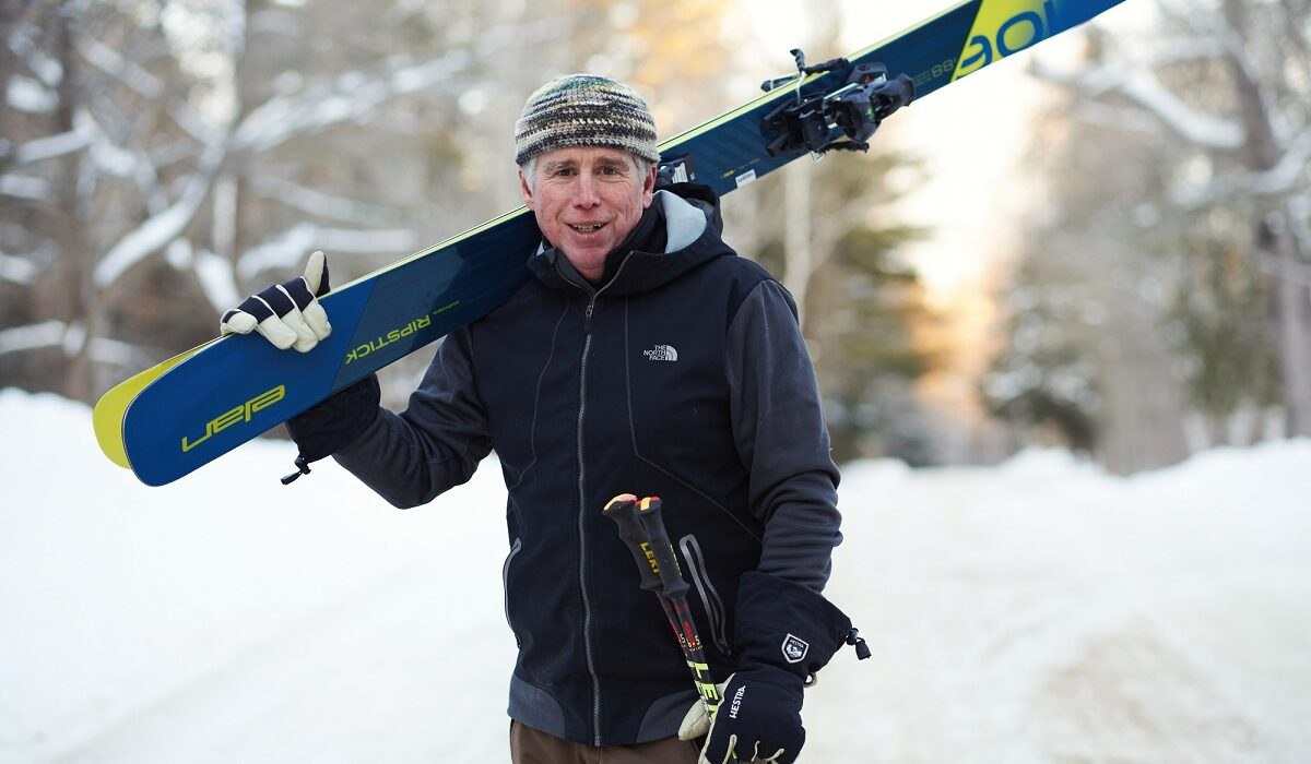 Dan Egan profile with skis