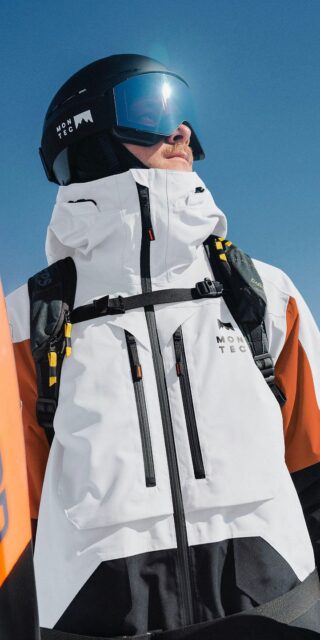 Montec white and orange shell jacket with high collar and chest pocket zips