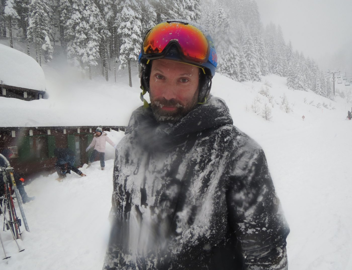 Patrick Thorne covered in fresh snow on a stormy powder day