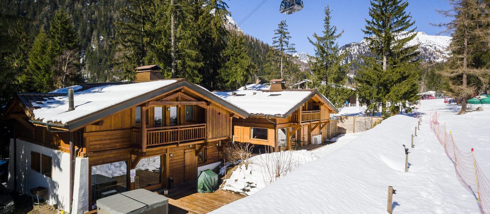 SkiWeekends Chalet Hideaway catered chalets in Argentière with the Grands Montets gondola overhead