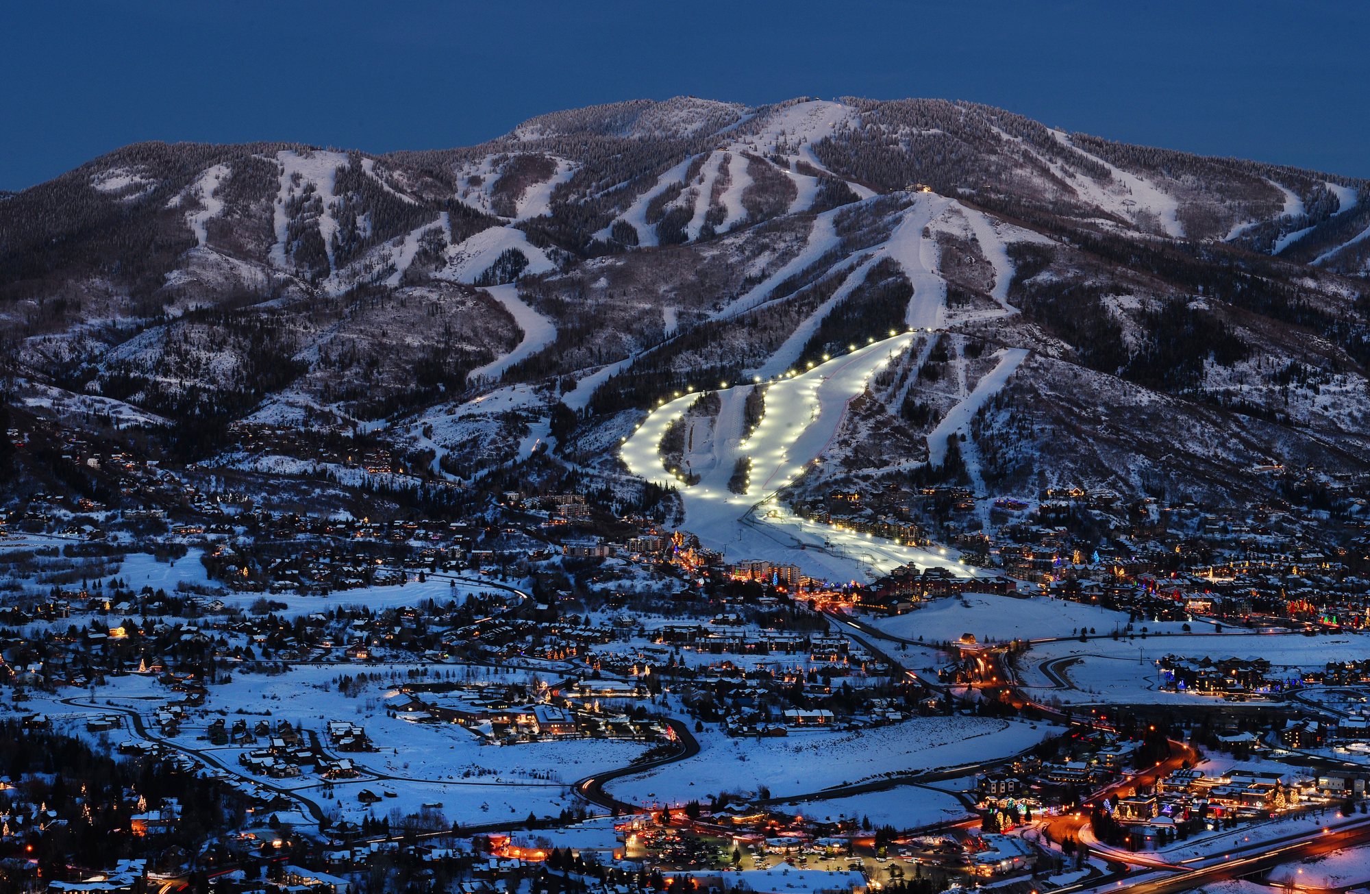 Night skiing lights on Mount Werner above Steamboat Springs at dusk
